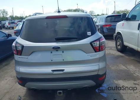 2017 Ford Escape Titanium z USA, uszkodzony, nr VIN 1FMCU0JD0HUD09406